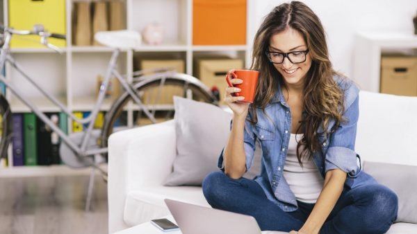 Woman Using Laptop At Home